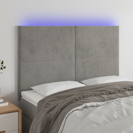 Sänggavel LED ljusgrå 144x5x118/128 cm sammet