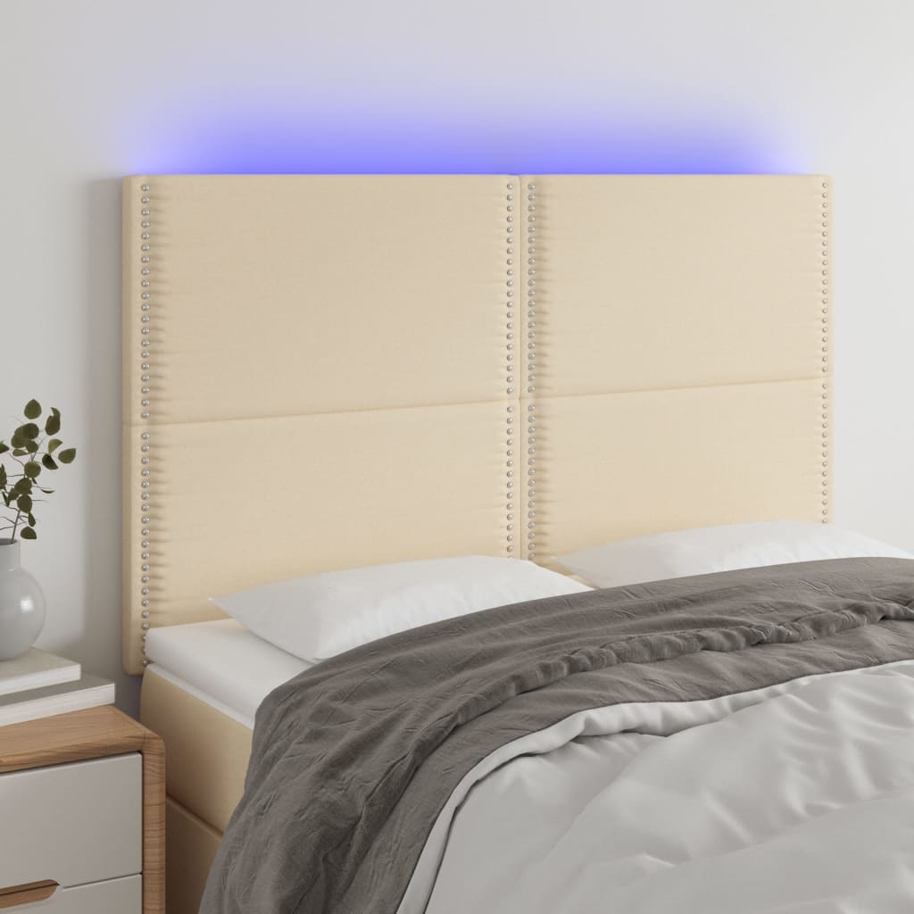 Sänggavel LED gräddvit 144x5x118/128 cm tyg