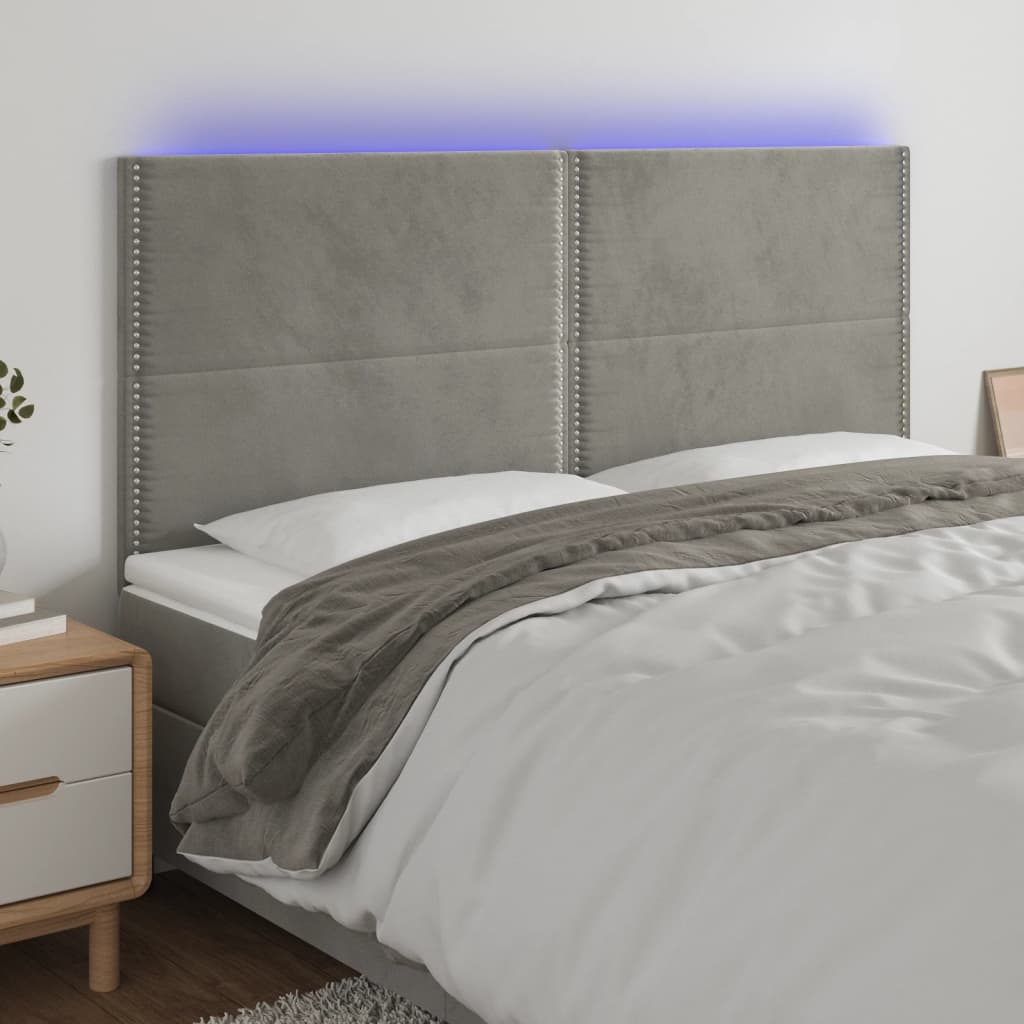 Sänggavel LED ljusgrå 160x5x118/128 cm sammet