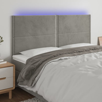 Sänggavel LED ljusgrå 200x5x118/128 cm sammet