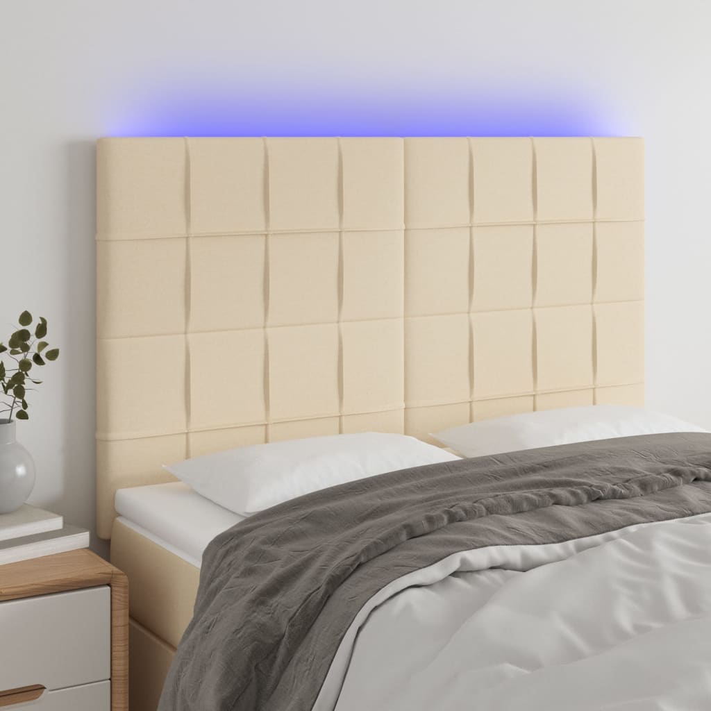 Sänggavel LED gräddvit 144x5x118/128 cm tyg