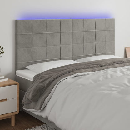 Sänggavel LED ljusgrå 180x5x118/128 cm sammet