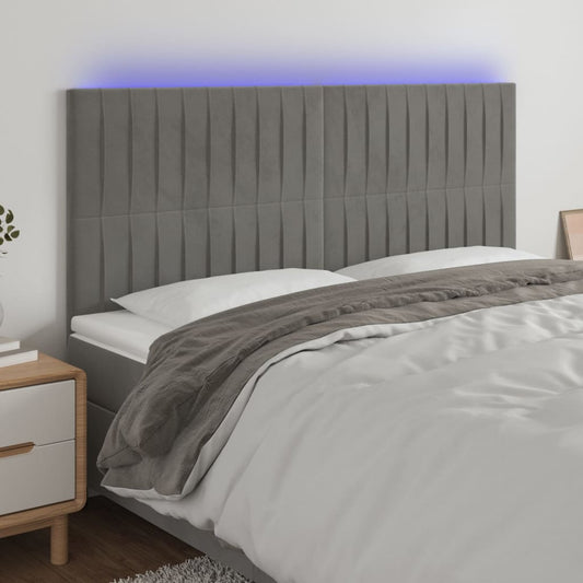 Sänggavel LED ljusgrå 180x5x118/128 cm sammet