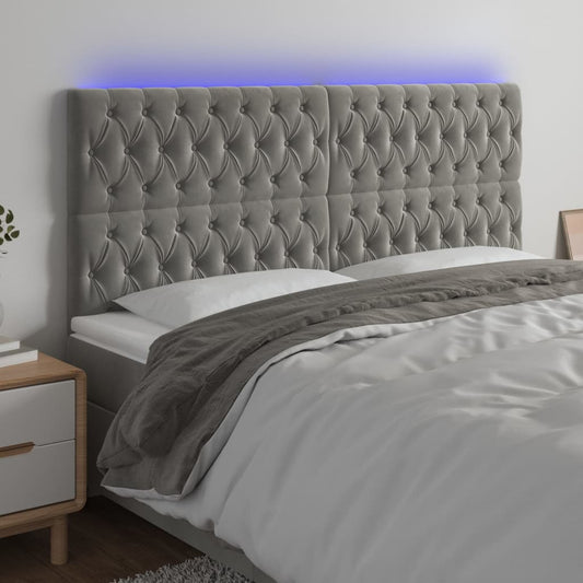 Sänggavel LED ljusgrå 180x7x118/128 cm sammet