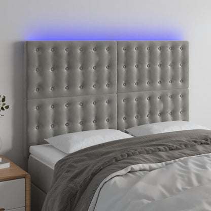 Sänggavel LED ljusgrå 144x5x118/128 cm sammet