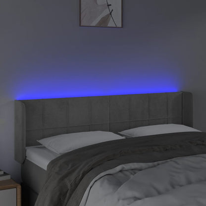 Sänggavel LED ljusgrå 147x16x78/88 cm sammet