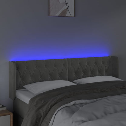 Sänggavel LED ljusgrå 147x16x78/88 cm sammet