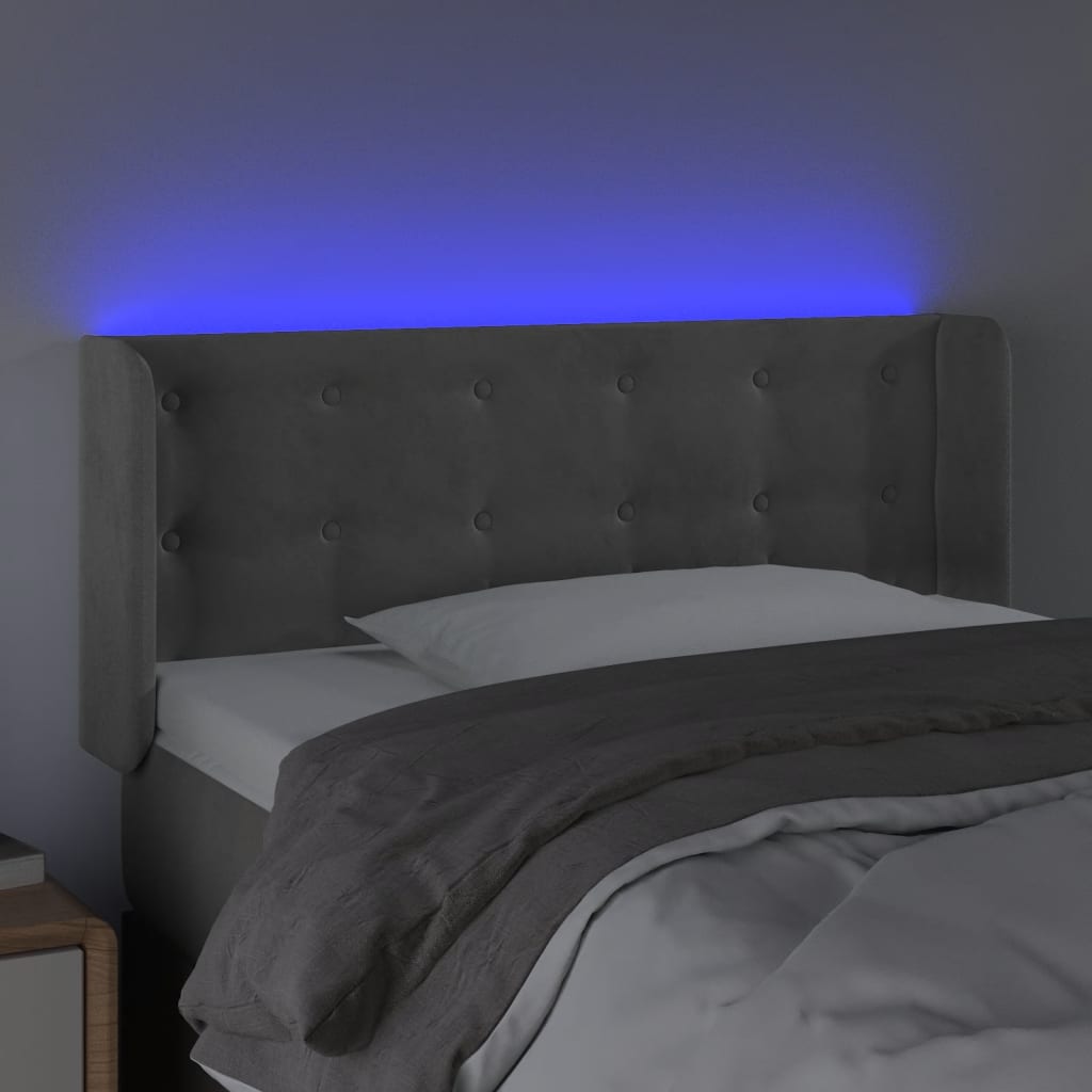 Sänggavel LED ljusgrå 83x16x78/88 cm sammet