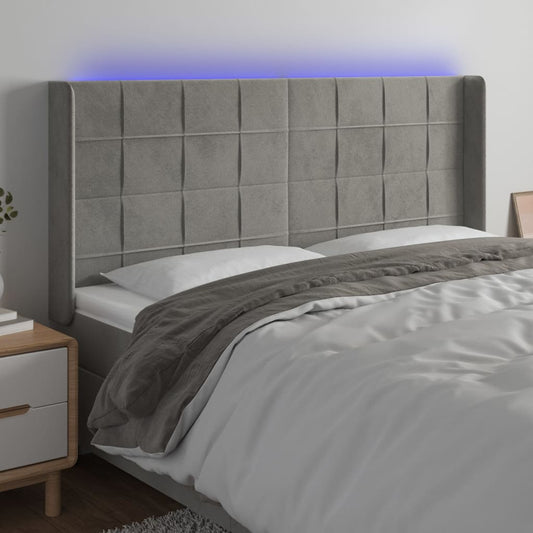 Sänggavel LED ljusgrå 183x16x118/128 cm sammet