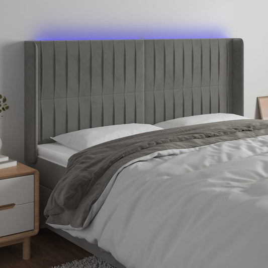 Sänggavel LED ljusgrå 203x16x118/128 cm sammet