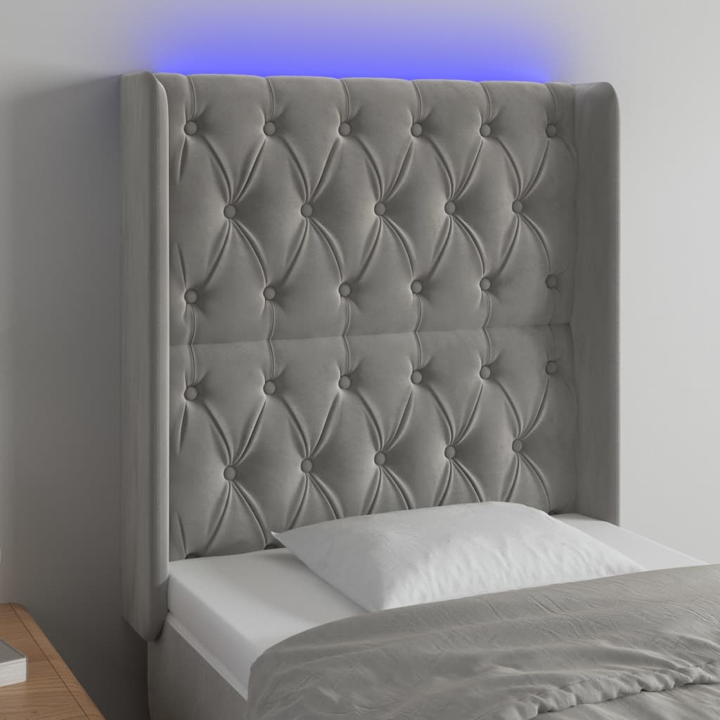 Sänggavel LED ljusgrå 83x16x118/128 cm sammet