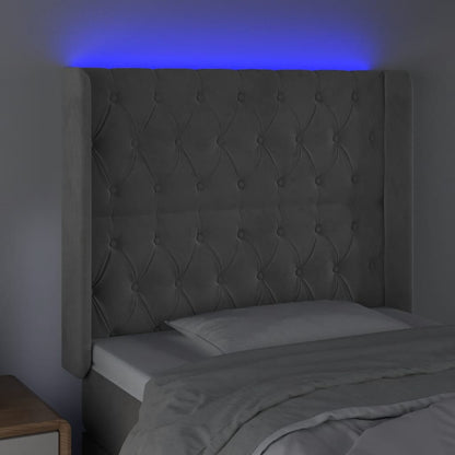 Sänggavel LED ljusgrå 103x16x118/128 cm sammet