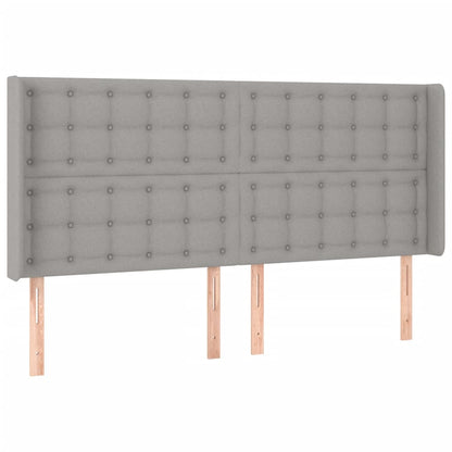 Sänggavel LED ljusgrå 203x16x118/128 cm tyg