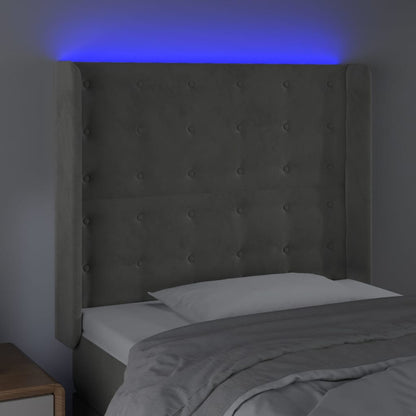 Sänggavel LED ljusgrå 83x16x118/128 cm sammet