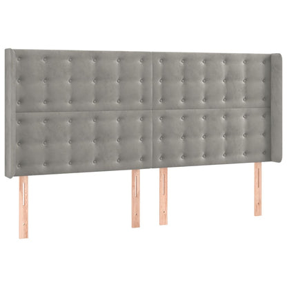 Sänggavel LED ljusgrå 163x16x118/128 cm sammet